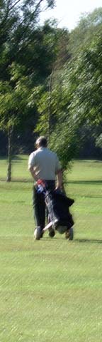 golfer heads up 2nd fairway